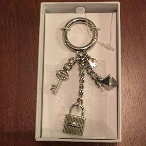 MICHAEL KORS MERCER LOCK & STAR KEYCHAIN